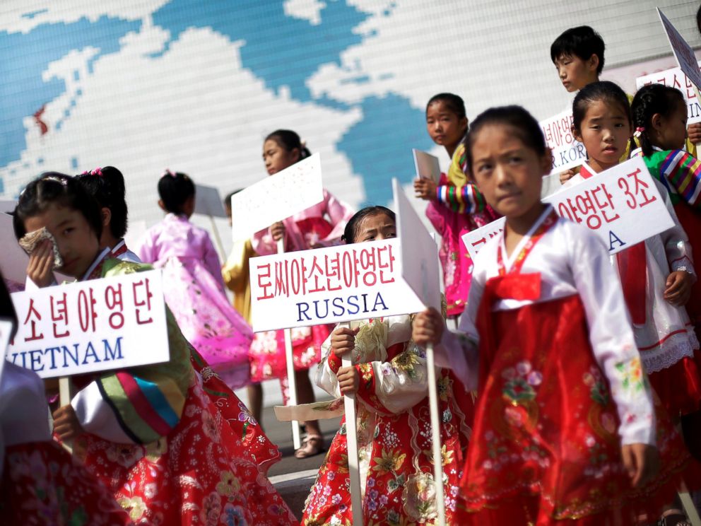 PHOTO: Young North Korean girls hold up signboards with the names of participating countries during an opening ceremony at the Songdowon International Childrens Camp, July 29, 2014, in Wonsan, North Korea.