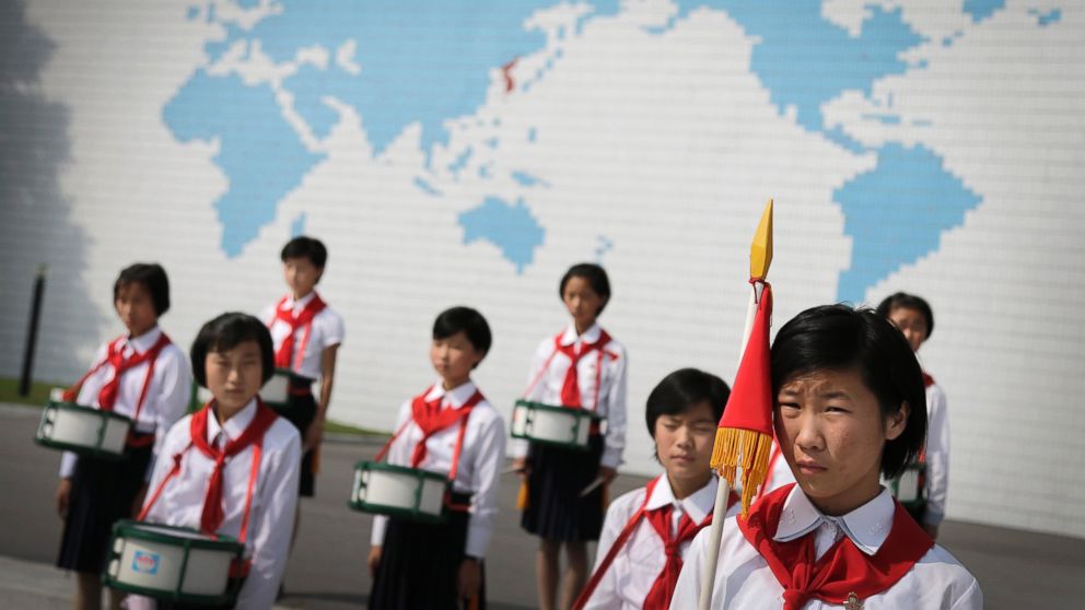 PHOTO: North Korean school girls stand in formation during an opening ceremony for the start of summer activities at the Songdowon International Children's Camp, July 29, 2014, in Wonsan, North Korea.