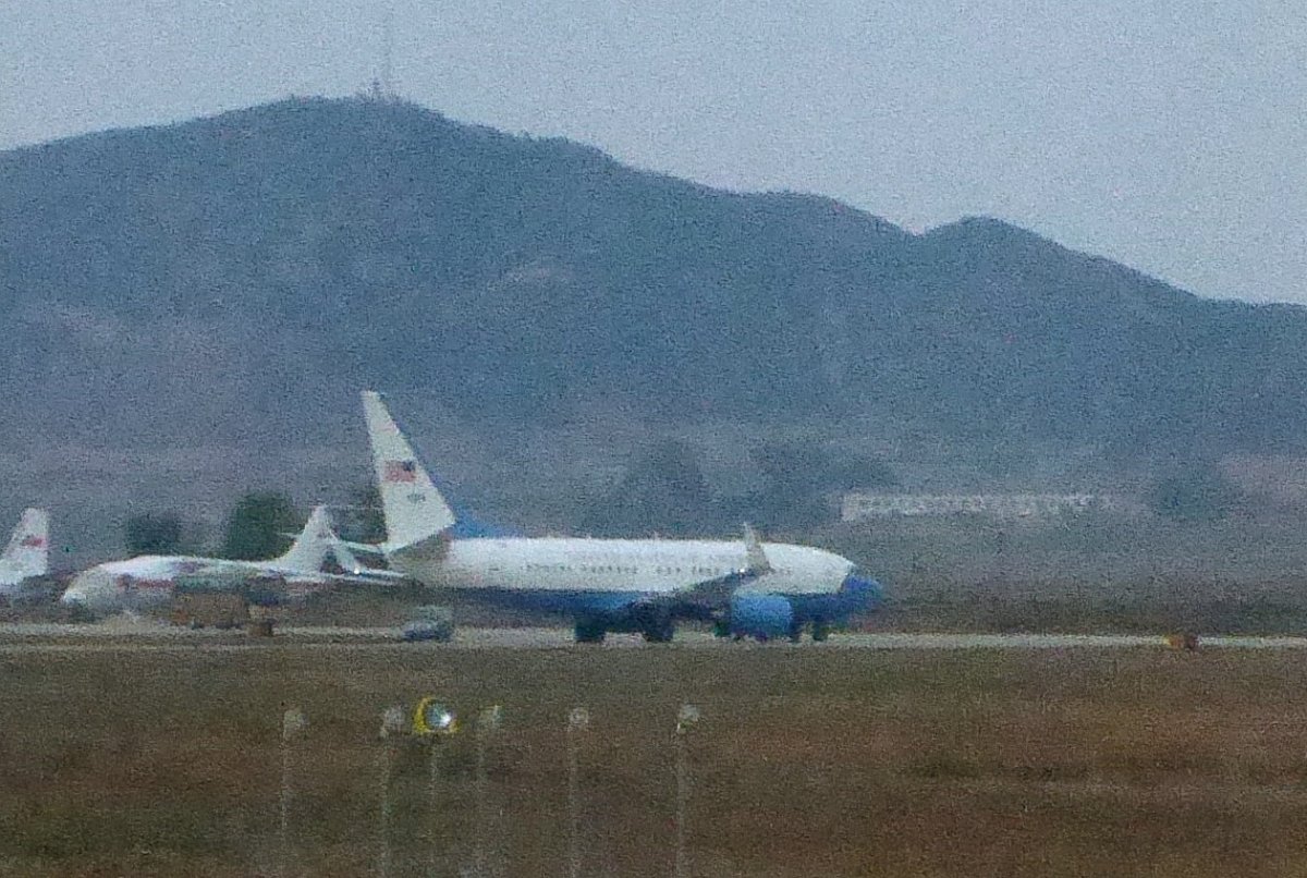 PHOTO: A United States Air Force passenger jet, right, is parked in Pyongyang, North Korea