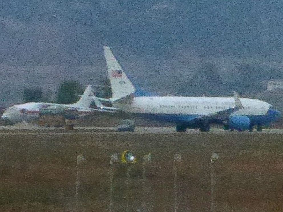 PHOTO: A United States Air Force passenger jet, right, is parked in Pyongyang, North Korea