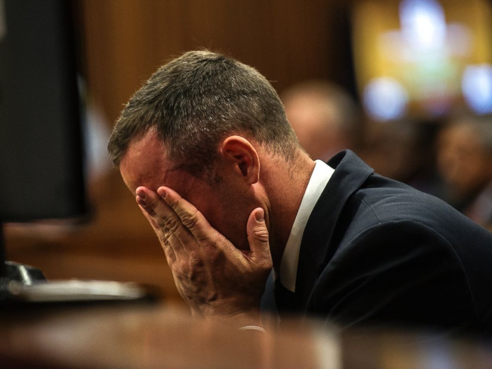 PHOTO: Oscar Pistorius cradles his head in his hands as he listens to evidence during his murder trial in Pretoria, South Africa, May 8, 2014.