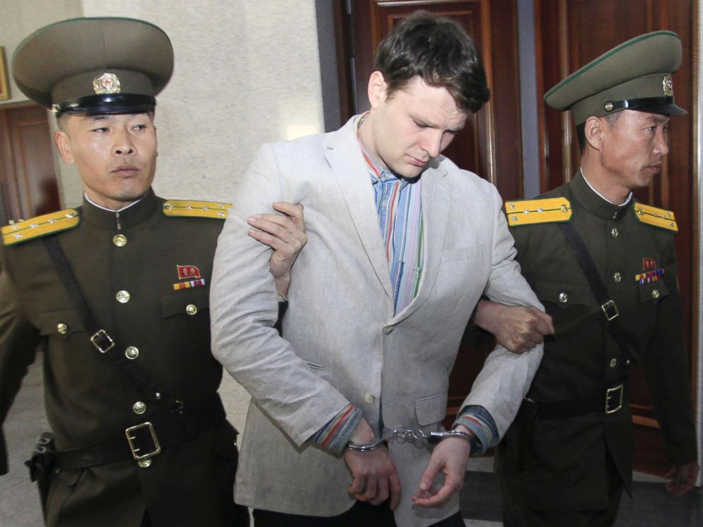 PHOTO: American student Otto Warmbier, center, is escorted at the Supreme Court in Pyongyang, North Korea, March 16, 2016.