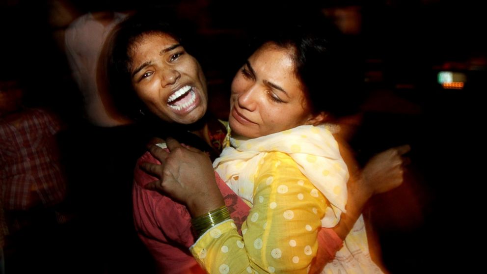 PHOTO: Women comfort each other as they mourn over the death of a family member who was killed in a bomb blast, at a local hospital in Lahore, Pakistan, March, 27, 2016. 