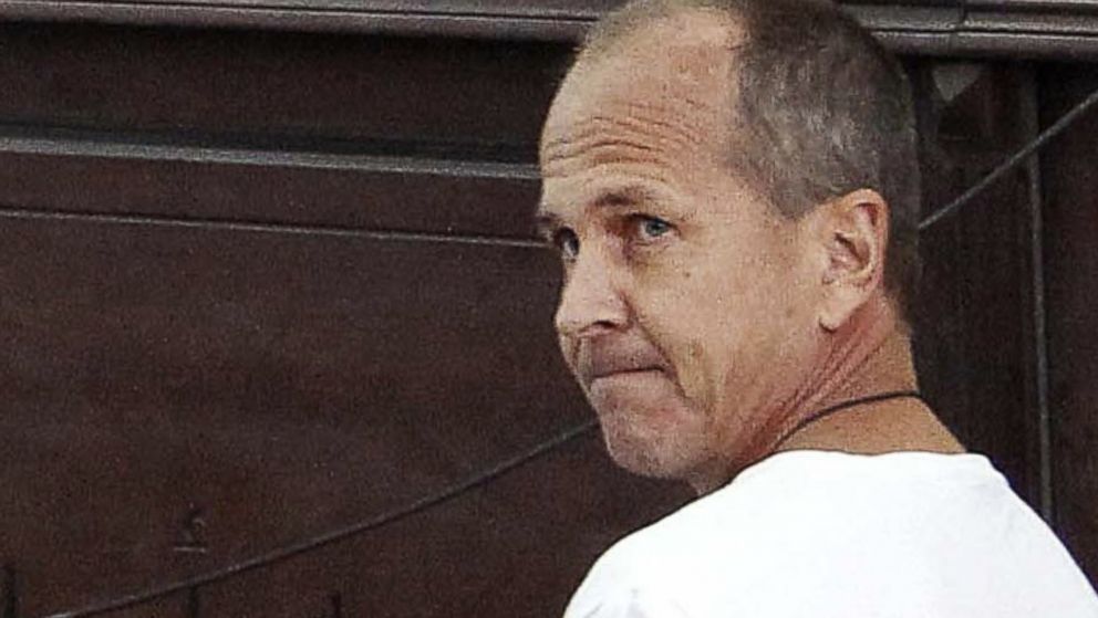 PHOTO: In this Monday, March 31, 2014 file photo, Al-Jazeera English correspondent Peter Greste, appears in court along with several other defendants during their trial on terror charges, in Cairo, Egypt. 