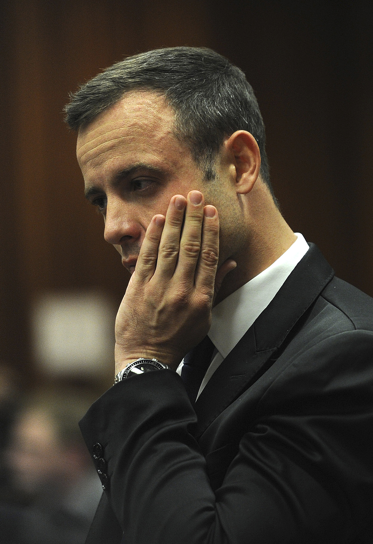 PHOTO: Oscar Pistorius puts his hand to his face in court on the fourth day of his trial at the high court in Pretoria, South Africa, March 6, 2014.  