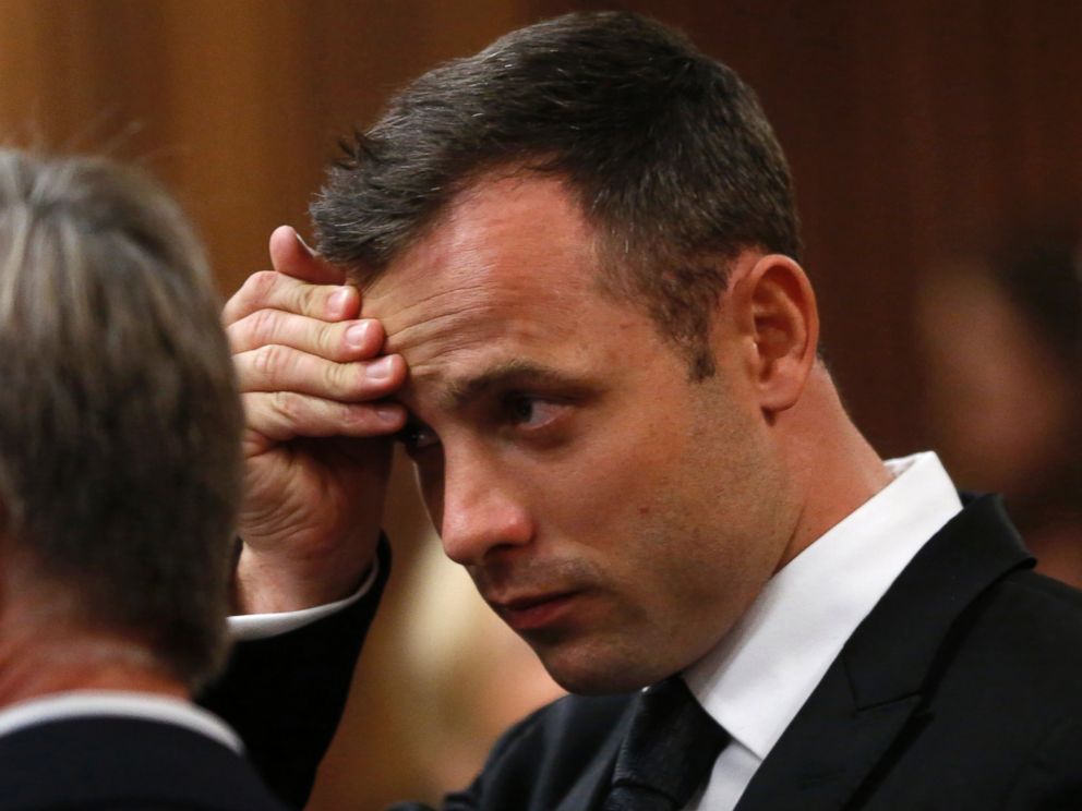 PHOTO: Oscar Pistorius holds his head  in court on the third day of his trial at the high court in Pretoria, South Africa, March 5, 2014. 