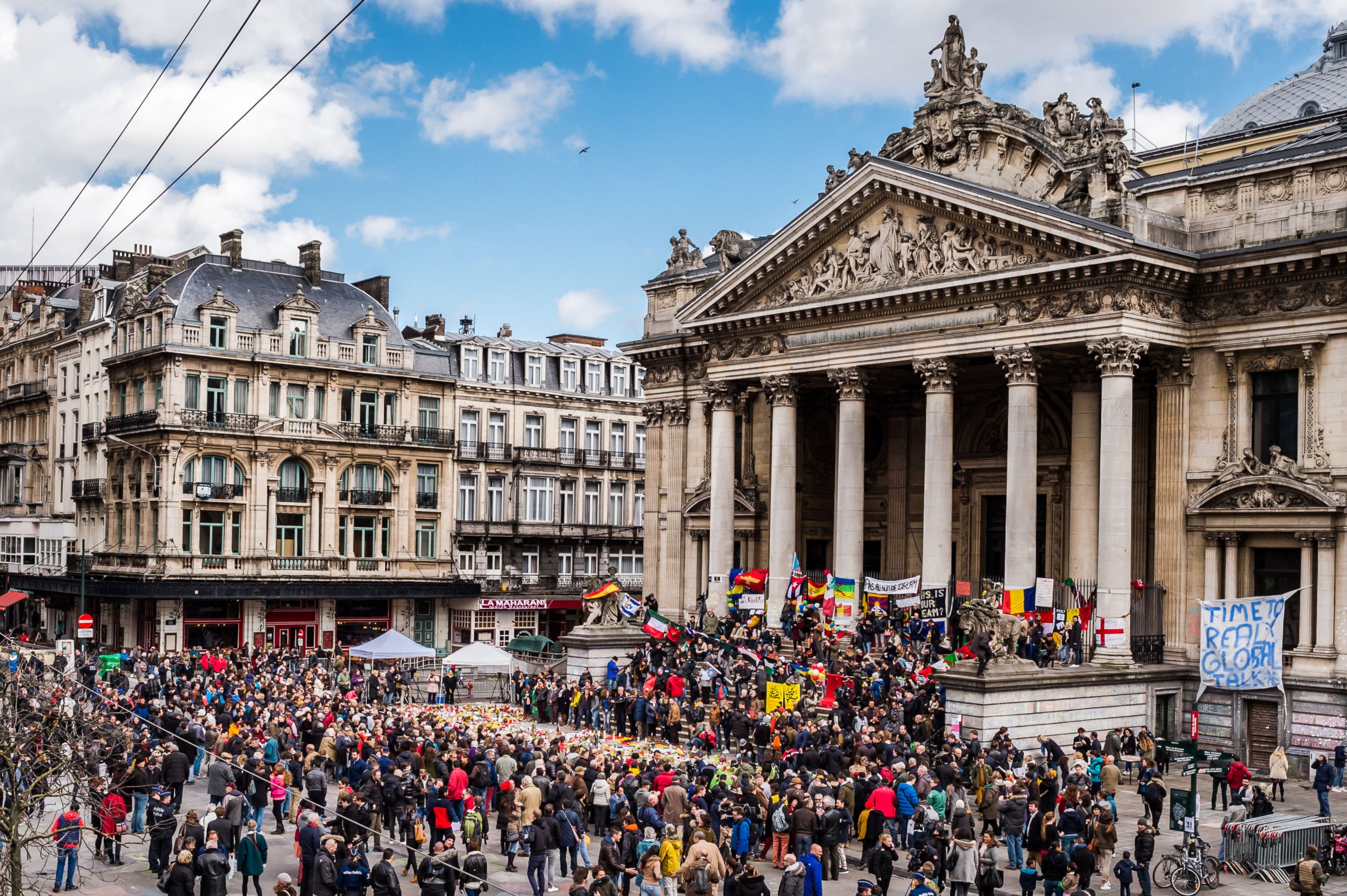 PHOTO: People gather at a memorial site at the Place de la Bourse in Brussels, March 27, 2016.  