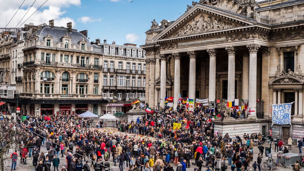People gather at a memorial site at the Place de la Bourse in Brussels, March 27, 2016.  