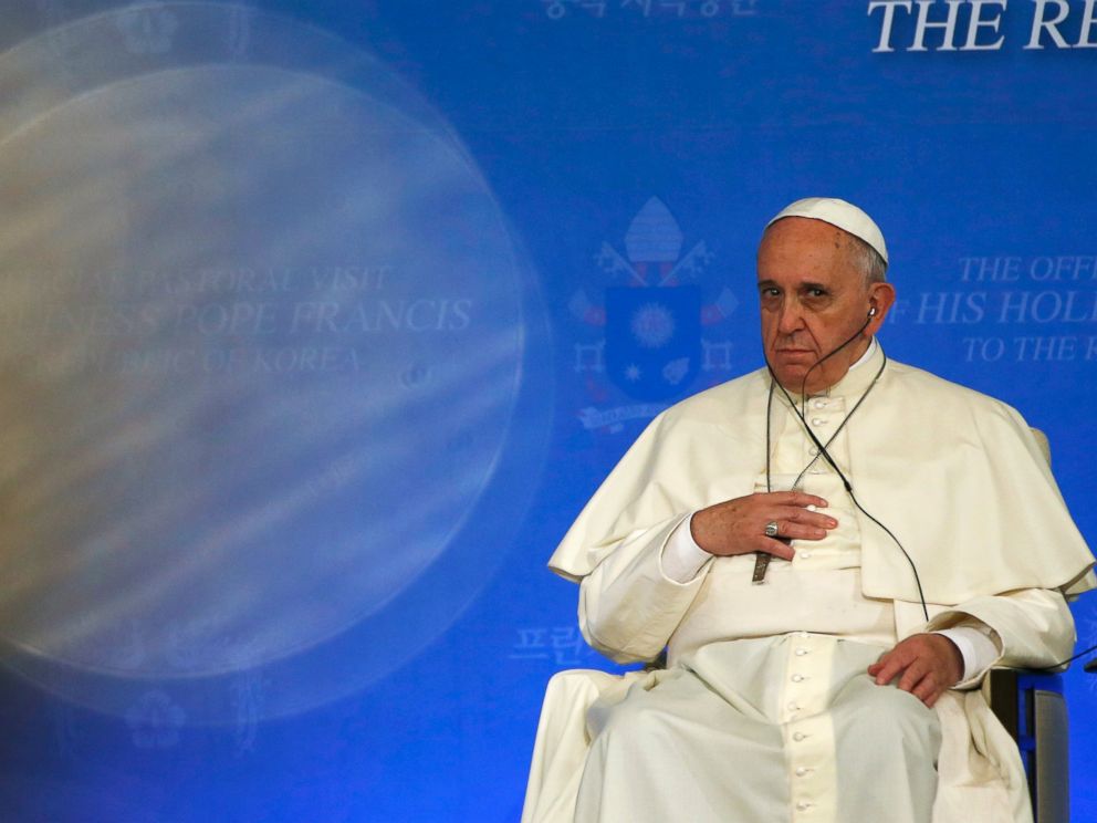 PHOTO: Pope Francis touches his cross while listening to South Korean President Park Geun-hyes speech during a news conference at the presidential Blue House in Seoul, South Korea, Aug. 14, 2014.