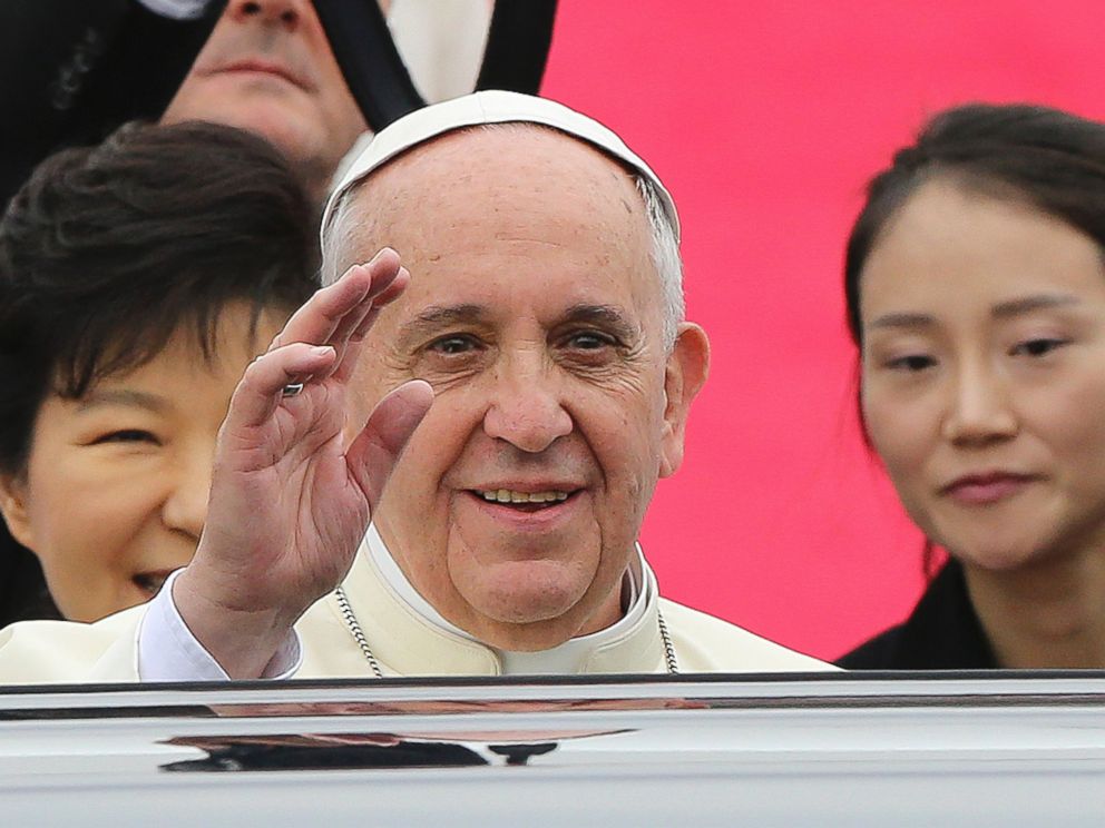 PHOTO: Pope Francis waves upon his arrival at Seoul Air Base as South Korean President Park Geun-hye, left, smiles in Seongnam, South Korea, Aug. 14, 2014.