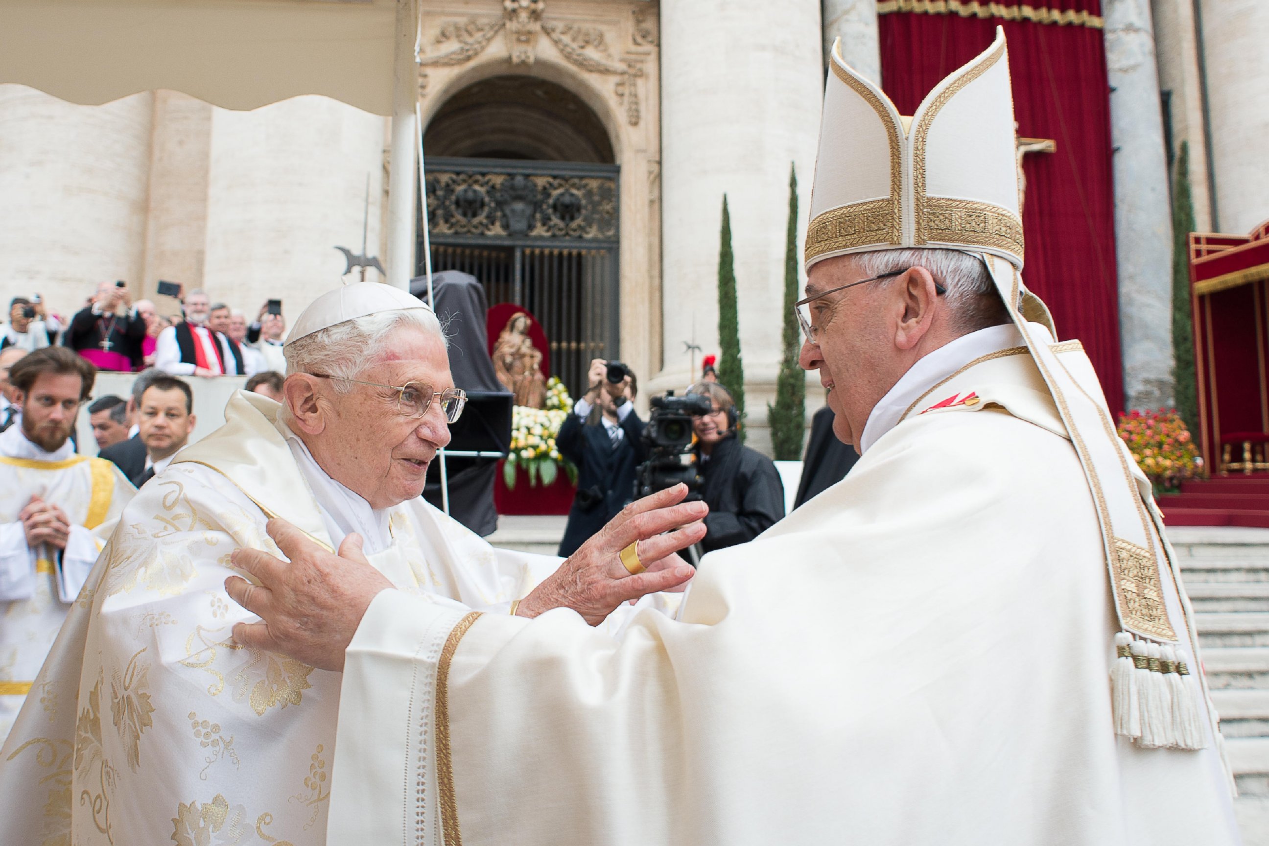 PHOTO: Pope Francis, right, embraces his predecessor Pope Emeritus Benedict XVI, during a ceremony in St. Peter's Square at the Vatican, Sunday, April 27, 2014.