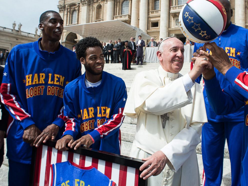 PHOTO: Harlem Globetrotters’ help Pope Francis spin the ball on his finger as they meet in St. Peter's Square at the Vatican, May 6, 2015.