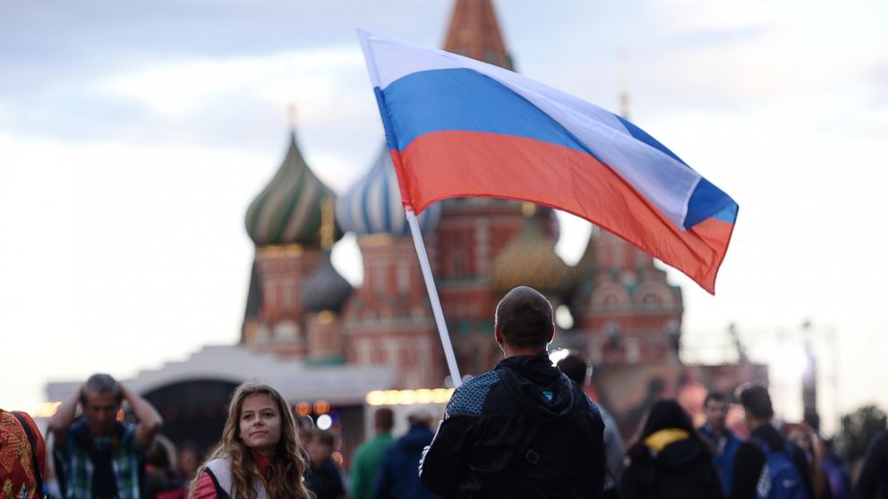 Muscovites are pictured at the gala concert devoted to the Russia Day gala concert on Red Square in Moscow, June 12, 2016. 
