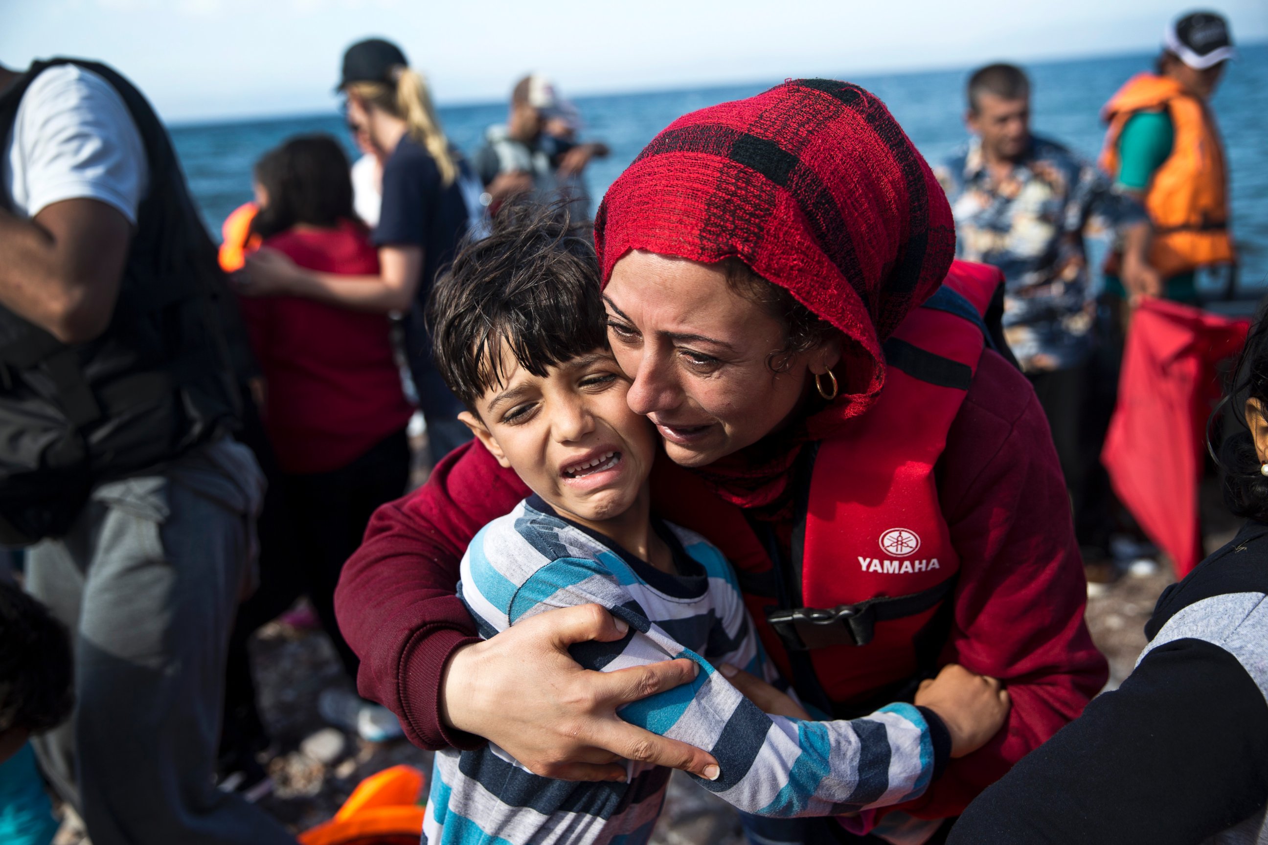 PHOTO:A Syrian woman embraces her child after they arrived with others refugees on a dinghy from Turkey to Lesbos island, Greece, Sept. 11, 2015. 