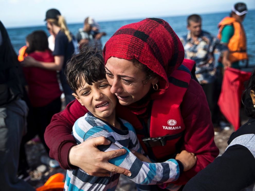 PHOTO:A Syrian woman embraces her child after they arrived with others refugees on a dinghy from Turkey to Lesbos island, Greece, Sept. 11, 2015.