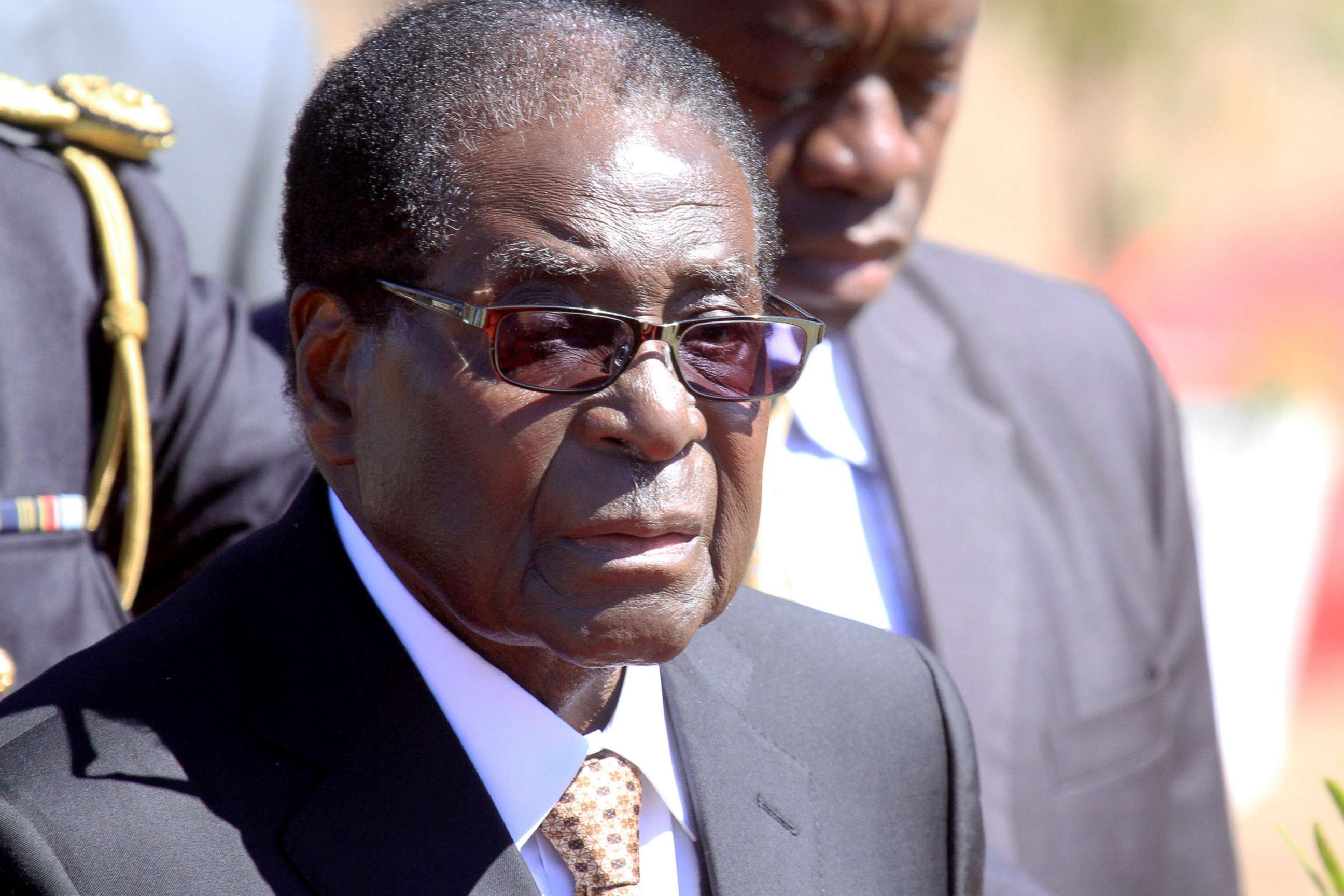 PHOTO: Zimbabwean President, Robert Mugabe, attends the burial of Major General Bandama who died after a short illness at the National Heroes acre in Harare, Zimbabwe, July, 17, 2014. 