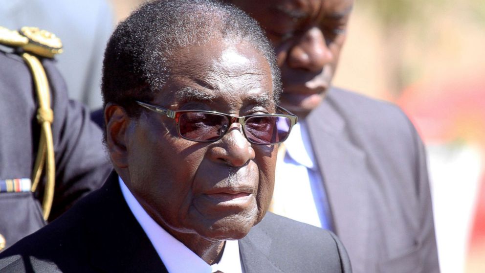 PHOTO: Zimbabwean President, Robert Mugabe, attends the burial of Major General Bandama who died after a short illness at the National Heroes acre in Harare, Zimbabwe, July, 17, 2014.