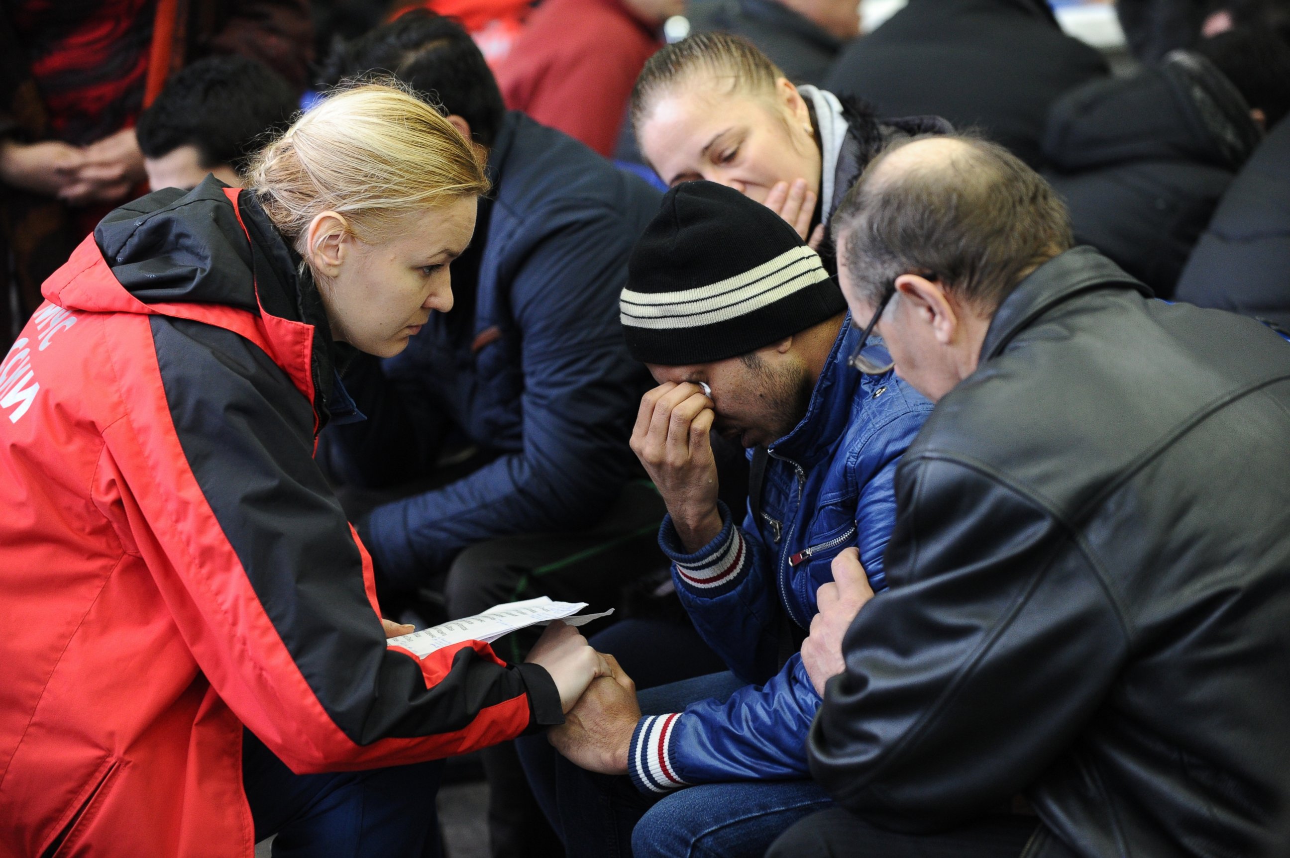 PHOTO: A Russian Emergency Situations Ministry employee, left, tries to comfort a relative of the plane crash victims at the Rostov-on-Don airport, Russia, March 19, 2016. 