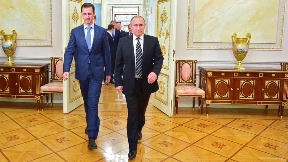 Russian President Vladimir Putin and Syria President Bashar Assad arrive for their meeting in the Kremlin in Moscow, Oct. 20, 2015.
