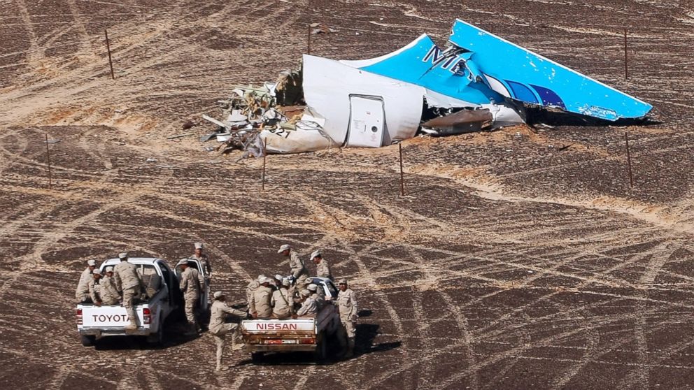 PHOTO: Egyptian Military cars approach a plane's tail at the wreckage of a passenger jet bound for St. Petersburg, Russia that crashed in Hassana, Egypt, on Sunday, Nov. 1, 2015. 