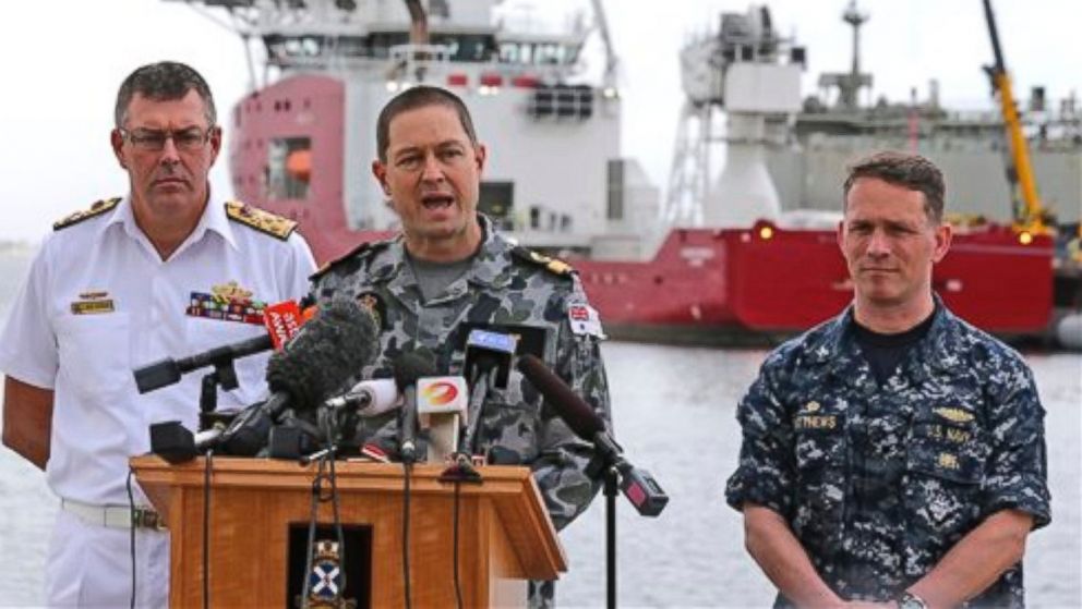 U.S. Navy Captain Mark Matthews right, Royal Australian Navy Commodore Peter Leavy commander of join task force 658, center, and Chief of the Navy Vice Admiral Ray Griggs speak at a press conference at naval base HMAS Stirling about the Defense ship Ocean Shield and her roll in the search for missing Malaysia Airlines Flight MH370 in Perth, Australia, Sunday, March 30, 2014.