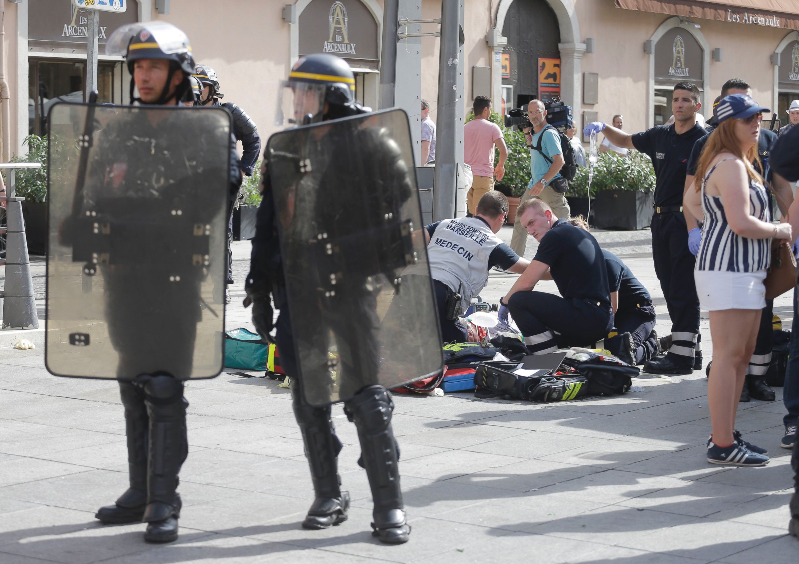 PHOTO: An man injured in clashes is assisted by the emergency services in downtown Marseille, France,  June 11, 2016.