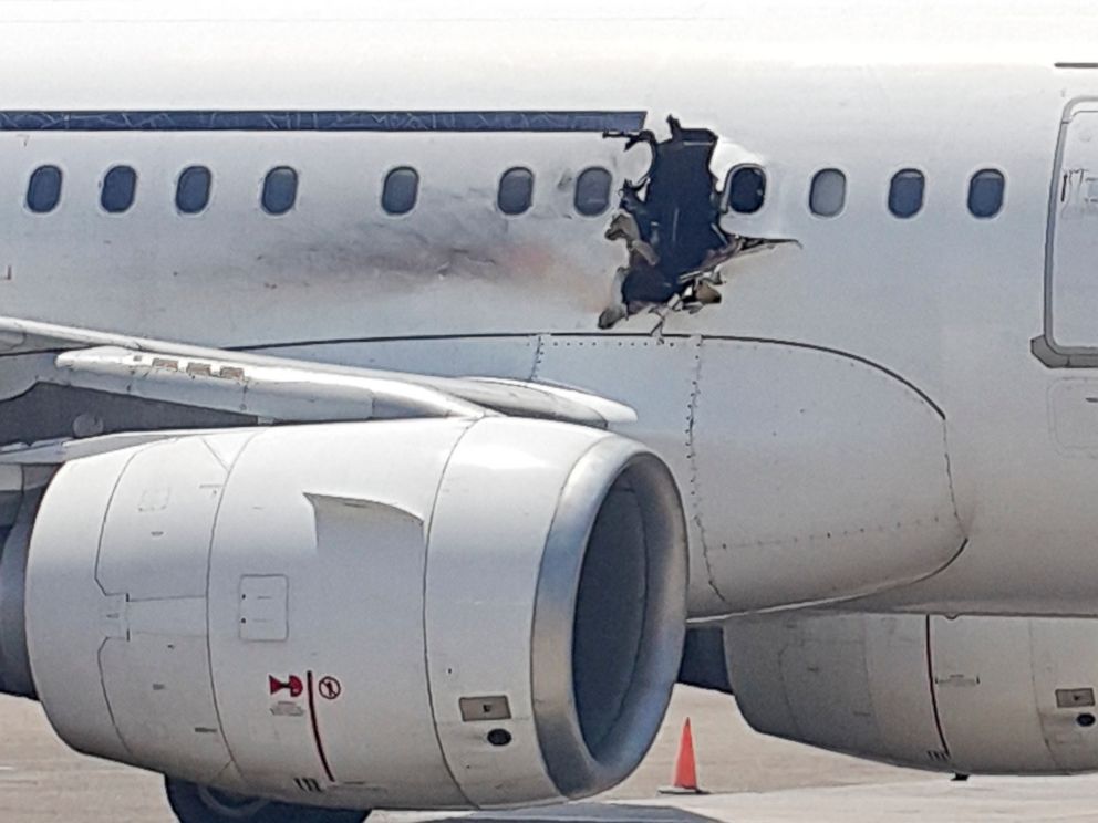 PHOTO:A hole is seen in a plane operated by Daallo Airlines as it sits on the runway of the airport in Mogadishu, Somalia, Feb. 2, 2016.