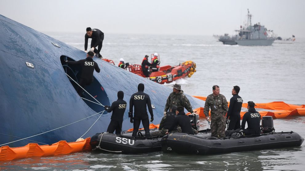 PHOTO: South Korean rescue team members search for passengers aboard a ferry sinking off South Korea's southern coast near Jindo, south of Seoul, South Korea on April 17, 2014. 