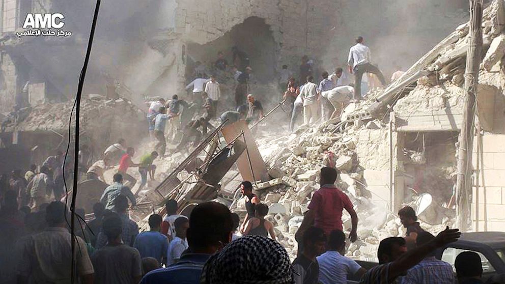 Syrians inspect the rubble of damaged buildings due to heavy shelling by Syrian government forces in Aleppo, Syria, Aug. 26, 2013, in this citizen journalism image, which has been authenticated based on its contents and other AP reporting,