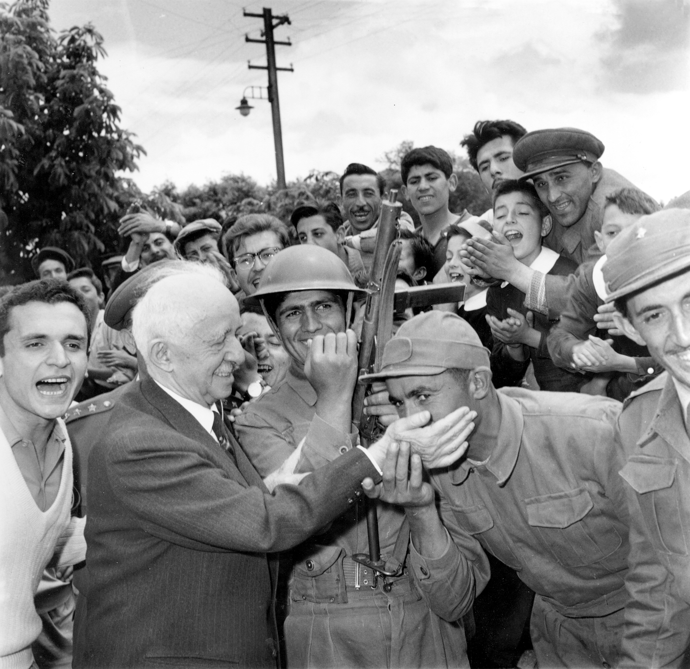 PHOTO: A Turkish soldier kisses the hand of Ismet Inonu, the 75-year-old former Turkish president and leader of the Republican People's Party, as the soldiers maintain guard duty outside his home in Ankara, Turkey, May 31, 1960.  