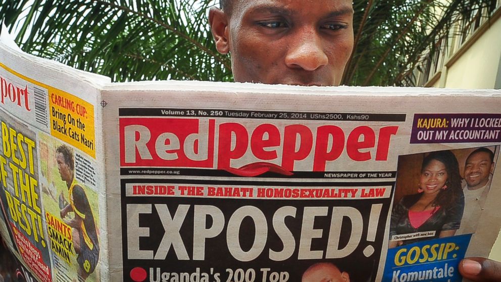A Ugandan reads a copy of the "Red Pepper" tabloid newspaper in Kampala, Uganda, Feb. 25, 2014. The Ugandan newspaper published a list Tuesday of what it called the country's "200 top" homosexuals, outing some Ugandans who previously had not identified themselves as gay, one day after the president Yoweri Museveni enacted a harsh anti-gay law.