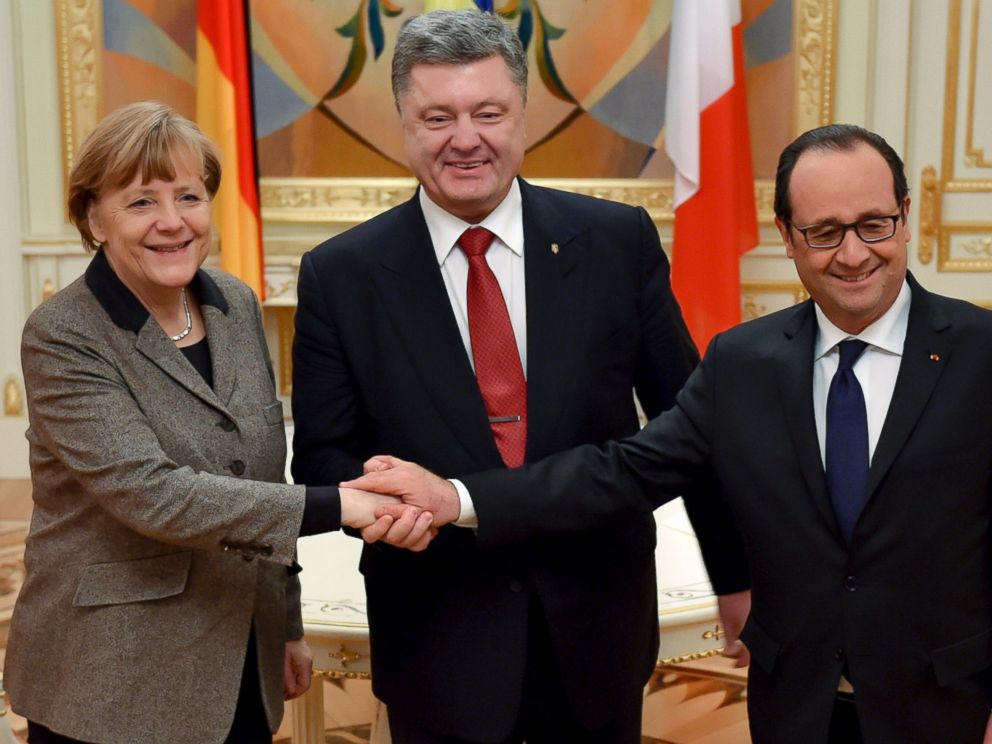 PHOTO: Ukrainian President Petro Poroshenko, center, French President Francois Hollande, right, and German Chancellor Angela Merkel shake hands during their meeting in Kiev, Ukraine, Feb. 5, 2015.