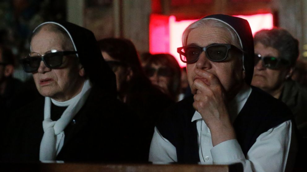 PHOTO: Nuns wear 3D glasses to watch the screening of the canonization of Pope John XXIII and Pope John Paul II taking place at the Vatican, at the parish church in Sotto il Monte Giovanni XXIII,Sunday, April 27, 2014. 