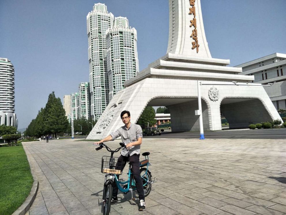 PHOTO: Alek Sigley stops for a photo in front of the Tower of Eternal Life, Pyongyang, North Korea, May 2018.