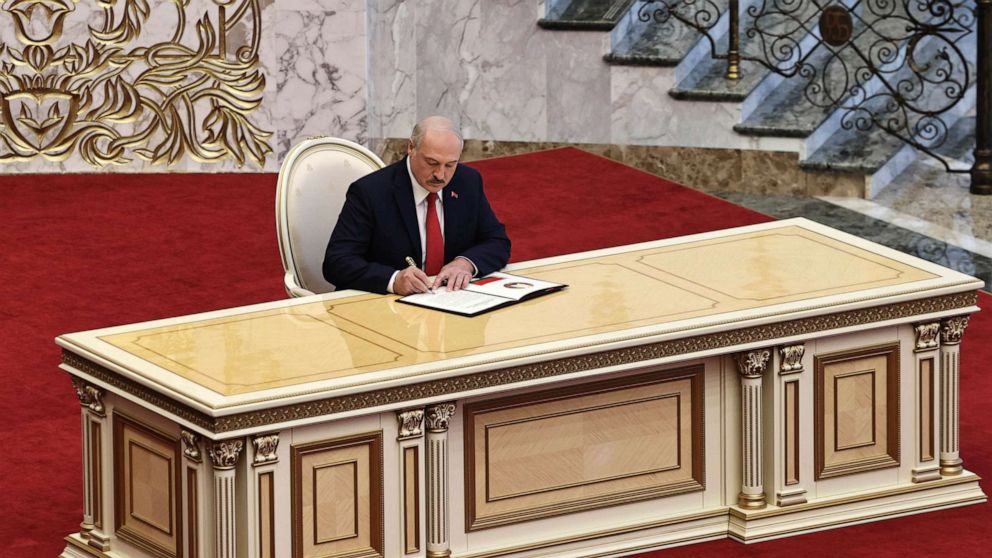 PHOTO: Belarusian President Alexander Lukashenko signs the inauguration certificate during his inauguration ceremony at the Palace of the Independence in Minsk, Belarus, Wednesday, Sept. 23, 2020.