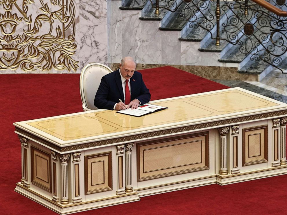 PHOTO: Belarusian President Alexander Lukashenko signs the inauguration certificate during his inauguration ceremony at the Palace of the Independence in Minsk, Belarus, Wednesday, Sept. 23, 2020.