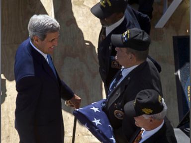 PHOTO:U.S. Secretary of State John Kerry greets the three Marines who lowered the flag at the U.S. Embassys closing in 1961, and who have returned at the flag raising ceremony at the newly opened embassy, in Havana.