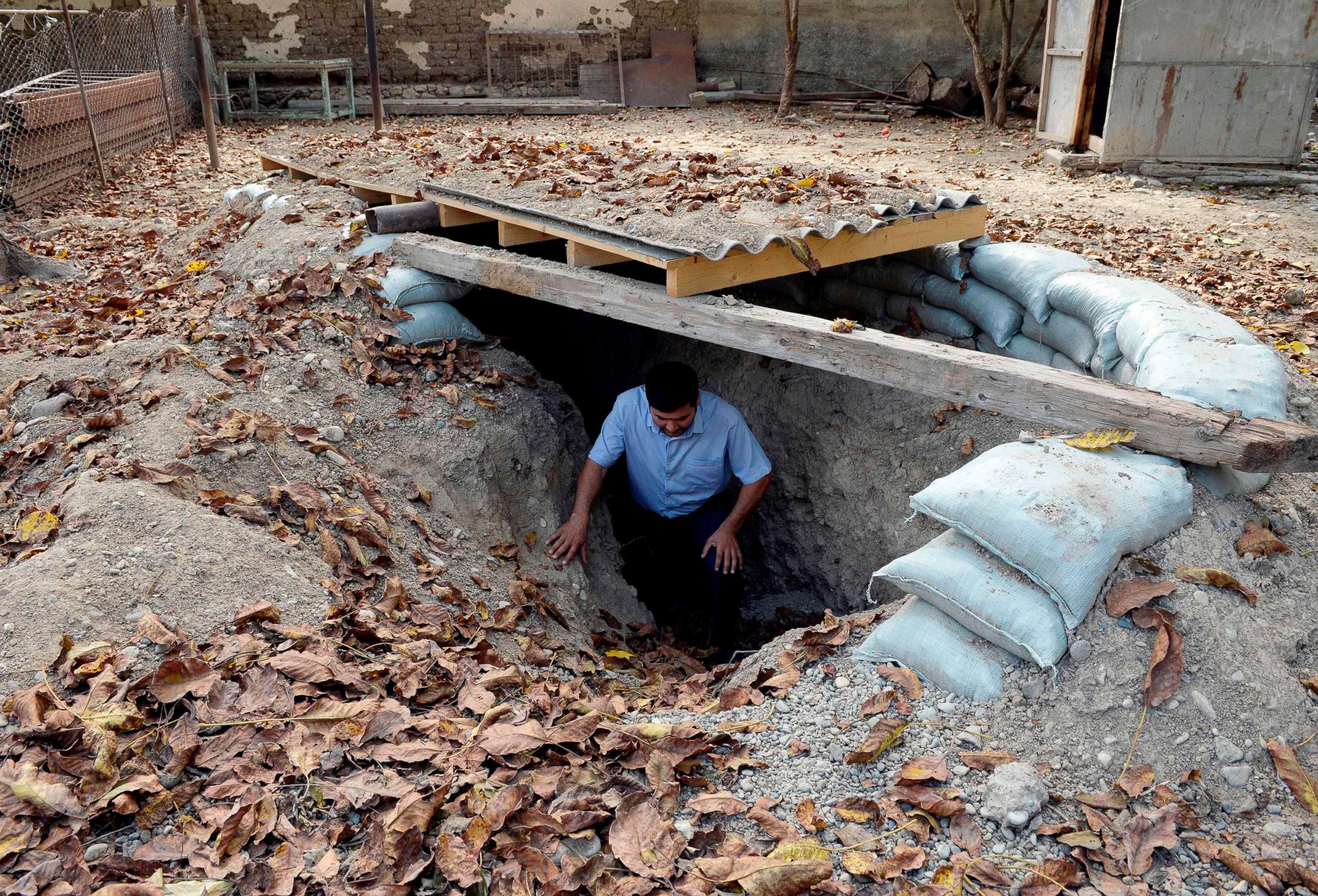 PHOTO: A man gets out of a makeshift bomb shelter in the village of Sahlabad outside the Azerbaijani city of Tartar, Sept. 29, 2020.