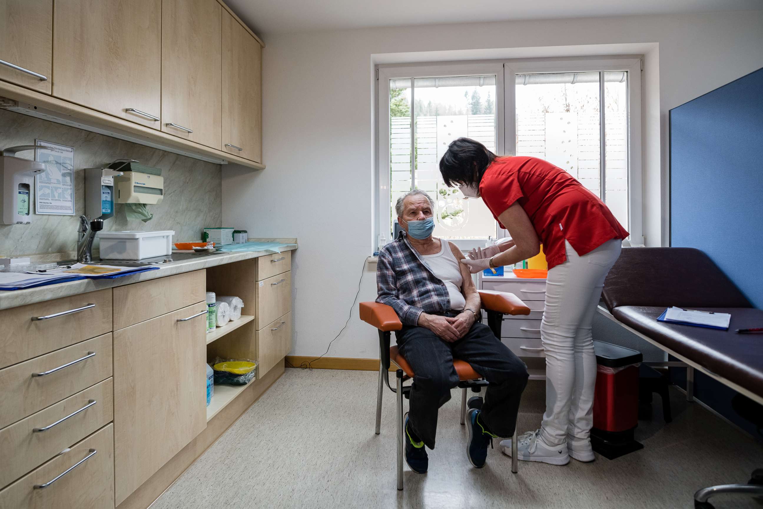 PHOTO: Nurse Susann Rettberg inoculates a local resident with the AstraZeneca vaccine against COVID-19, March 15, 2021, in Dippoldiswalde, Germany. 