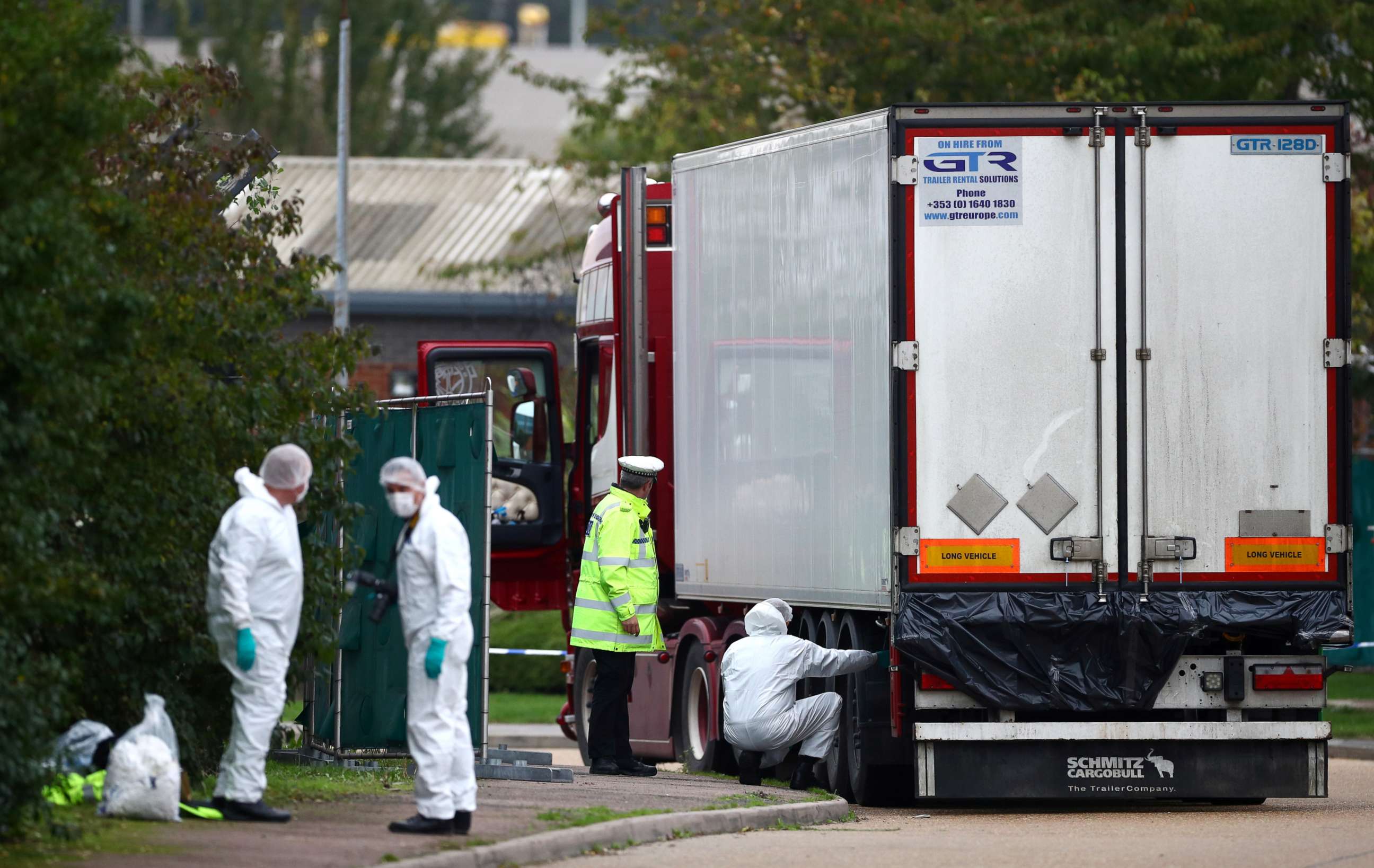PHOTO: Police are seen at the scene where bodies were discovered in a lorry container, in Grays, Essex, Britain October 23, 2019.  REUTERS/Hannah McKay