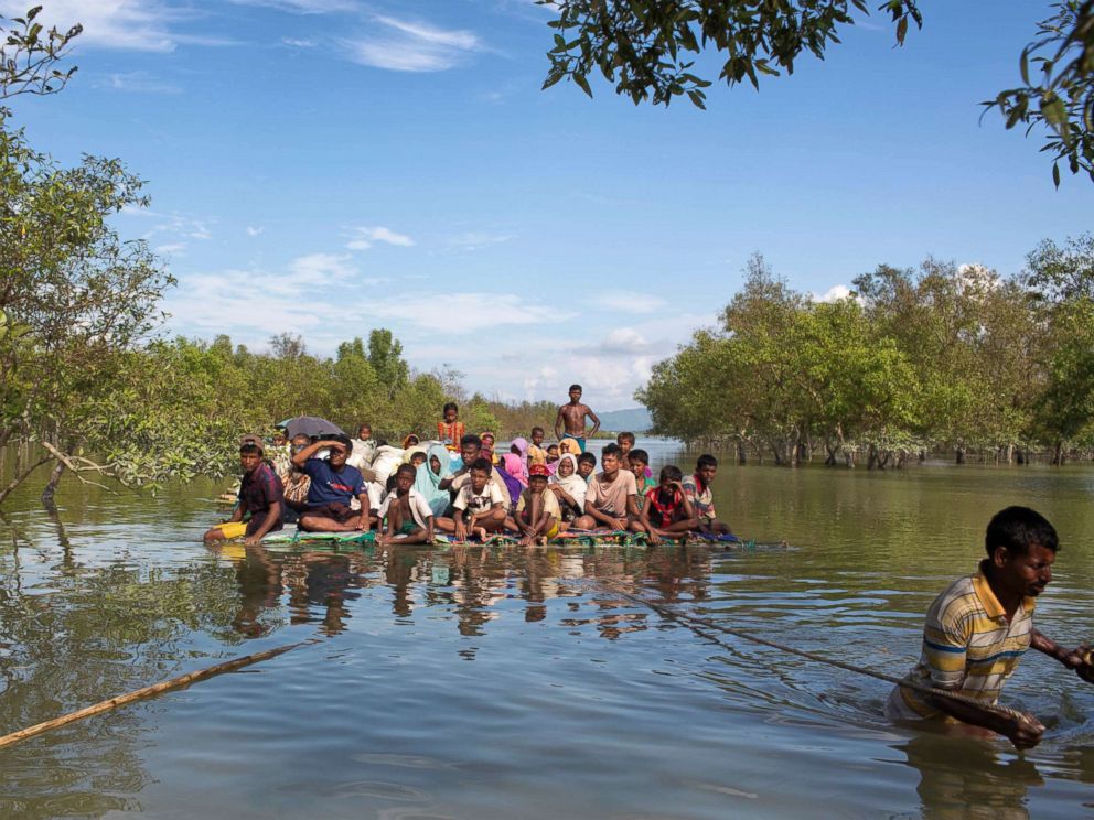 PHOTO: Rohingya Muslims travel on a raft made with plastic containers on which they crossed over the Naf river from Myanmar into Bangladesh, near Shah Porir Dwip, Bangladesh, Nov. 11, 2017. U.N.