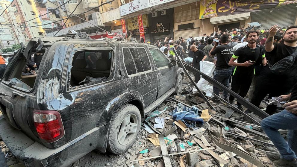 PHOTO: People gather at the site of an Israeli strike targeting a residential building in the Haret Hreik neighborhood in Beirut's southern suburbs, in Lebanon, on Nov. 23, 2025.