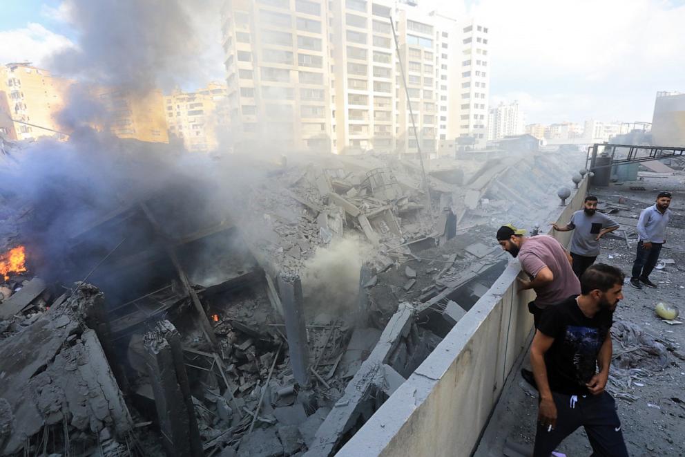 PHOTO: People check the site of an overnight Israeli airstrike in Beirut's southern suburb of Shayyah, Lebanon on Oct. 2, 2024.