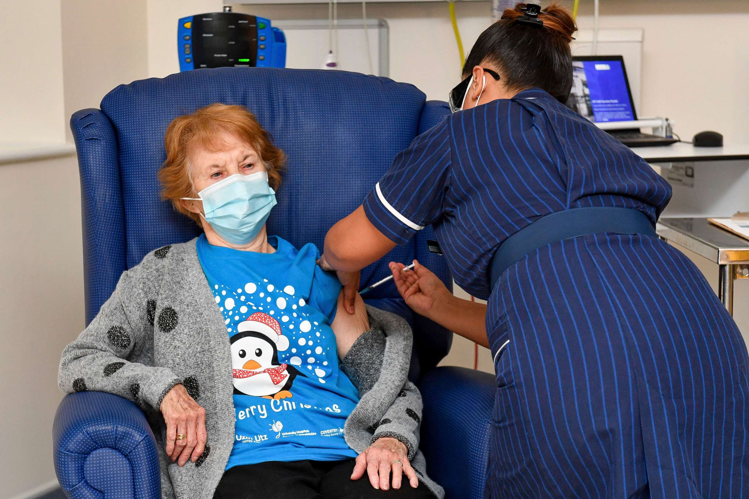 PHOTO: 90 year old Margaret Keenan, the first patient in the UK to receive the Pfizer-BioNTech COVID-19 vaccine, administered by nurse May Parsons at University Hospital, Coventry, England, Tuesday Dec. 8, 2020. 