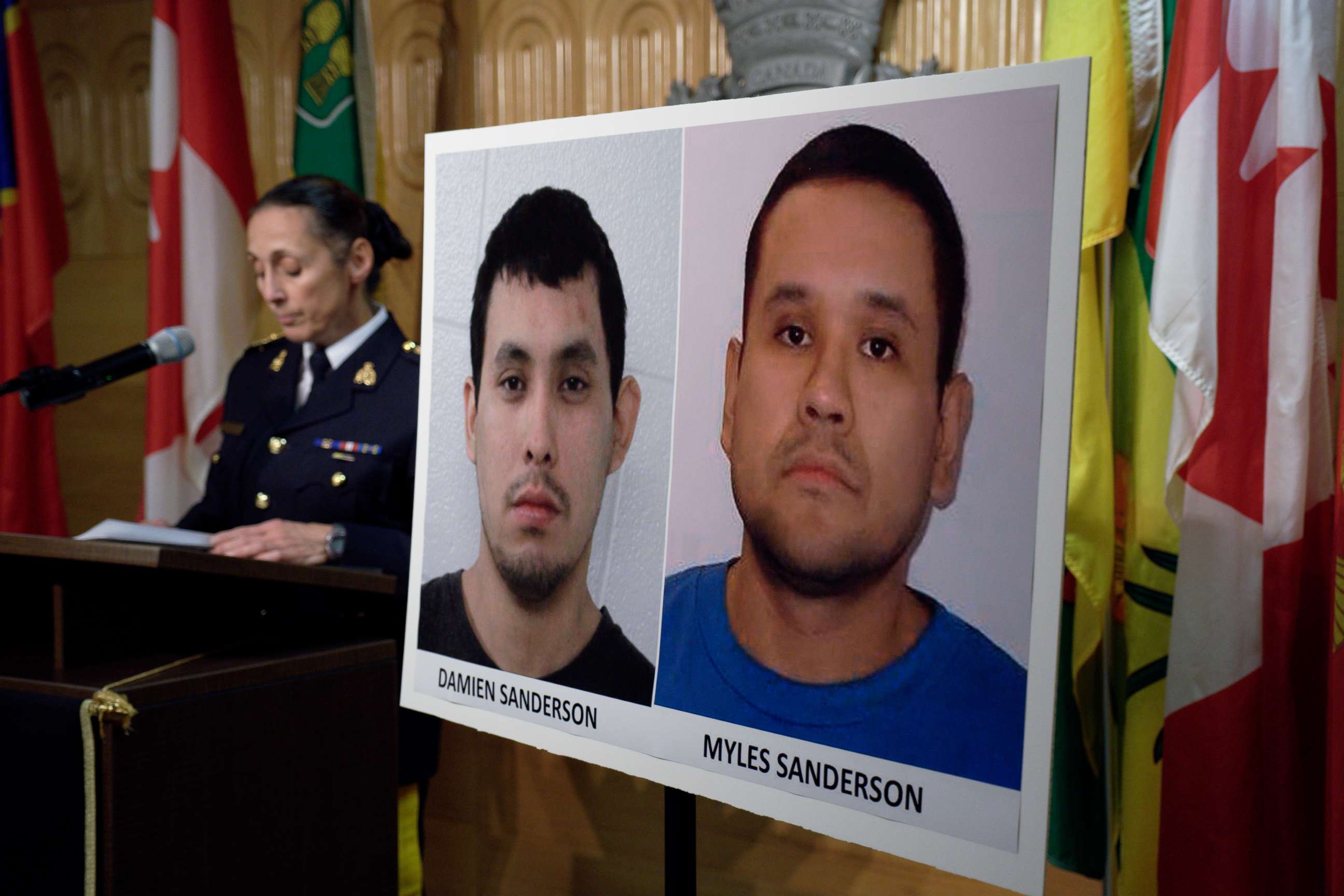 PHOTO: Assistant Commissioner Rhonda Blackmore speaks next to images of Damien Sanderson and Myles Sanderson during a press conference at the Royal Canadian Mounted Police "F" Division headquarters in Regina, Saskatchewan, Sept. 4, 2022.