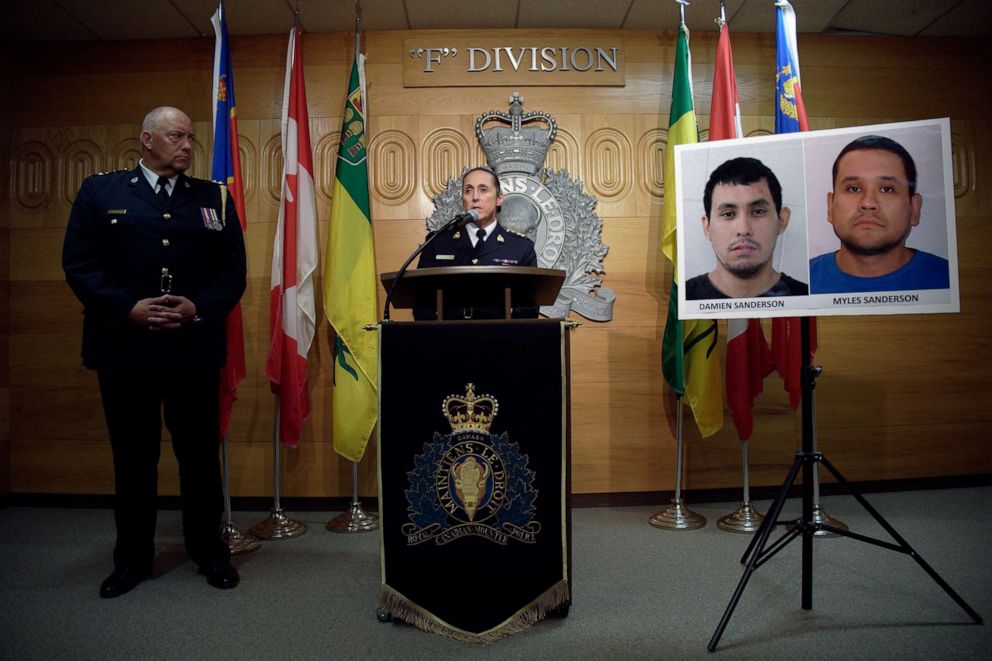 PHOTO: Assistant Commissioner Rhonda Blackmore speaks while Regina Police Chief Evan Bray, left, looks on during a press conference at RCMP "F" Division Headquarters in Regina, Saskatchewan, on Sunday, Sept. 4, 2022. 