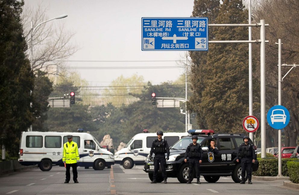 PHOTO: Police in tactical gear block a road leading to the Diaoyutai State Guesthouse in Beijing, Tuesday, March 27, 2018. 