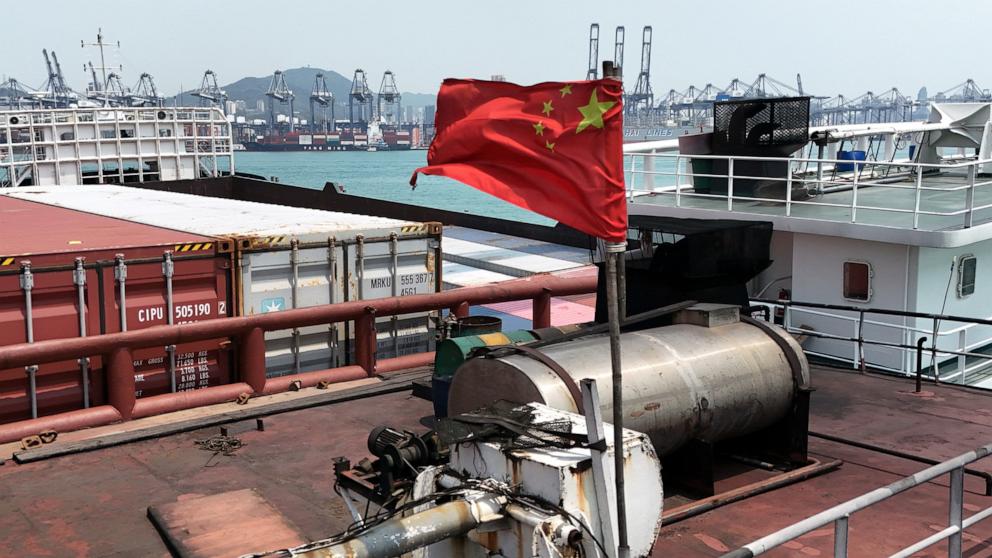 PHOTO: A drone view shows a Chinese flag on a cargo ship at the terminals at the port in Kwai Chung in Hong Kong, China, on April 3, 2025.