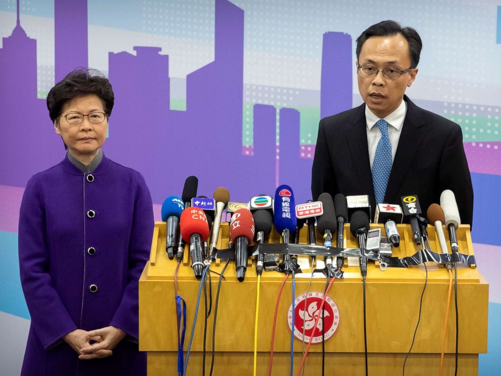PHOTO: Patrick Nip, Hong Kongs Secretary for Constitutional and Mainland Affairs, speaks as Chief Executive Carrie Lam listens during a press conference in Beijing, Wednesday, Nov. 6, 2019. (AP Photo/Mark Schiefelbein)