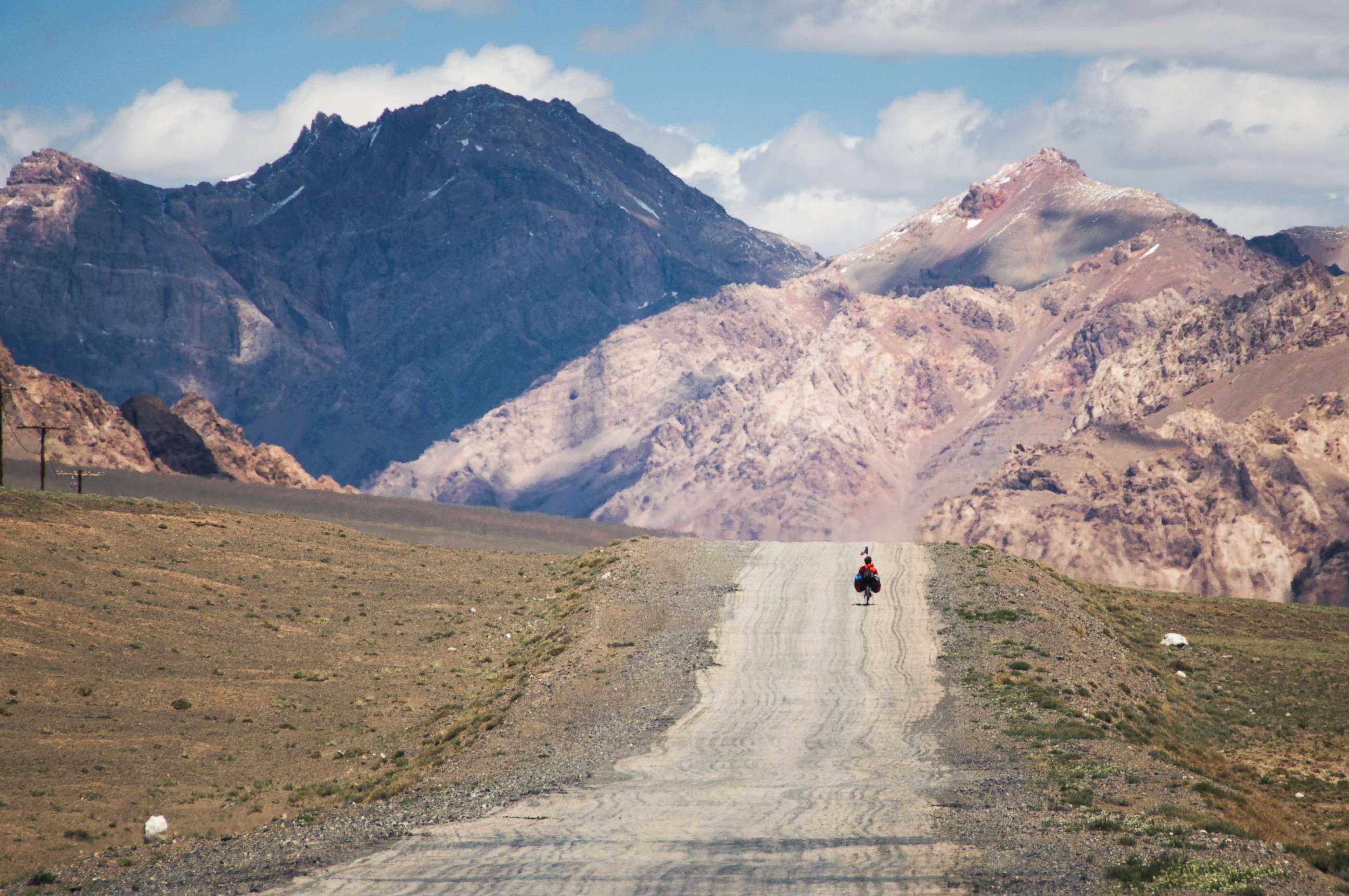 PHOTO: A traveler on the M41 road (also called Pamir highway), crossing the Pamir plateau in Tajikistan. 